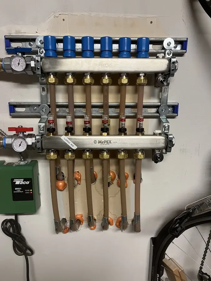 Plumber performing Gas Leak Detection at a residential property in Perinton